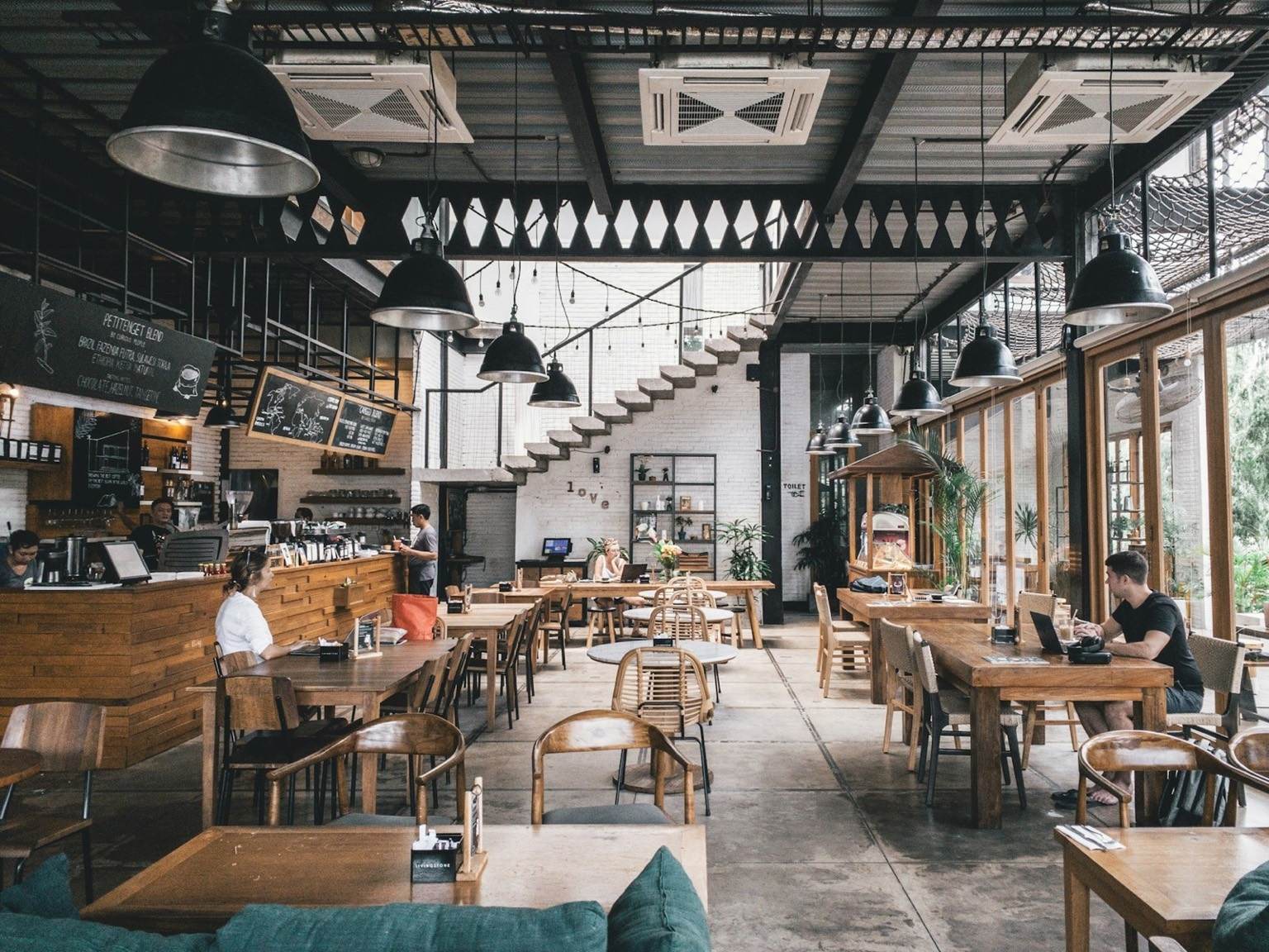 Busy independent café with customers and staff
